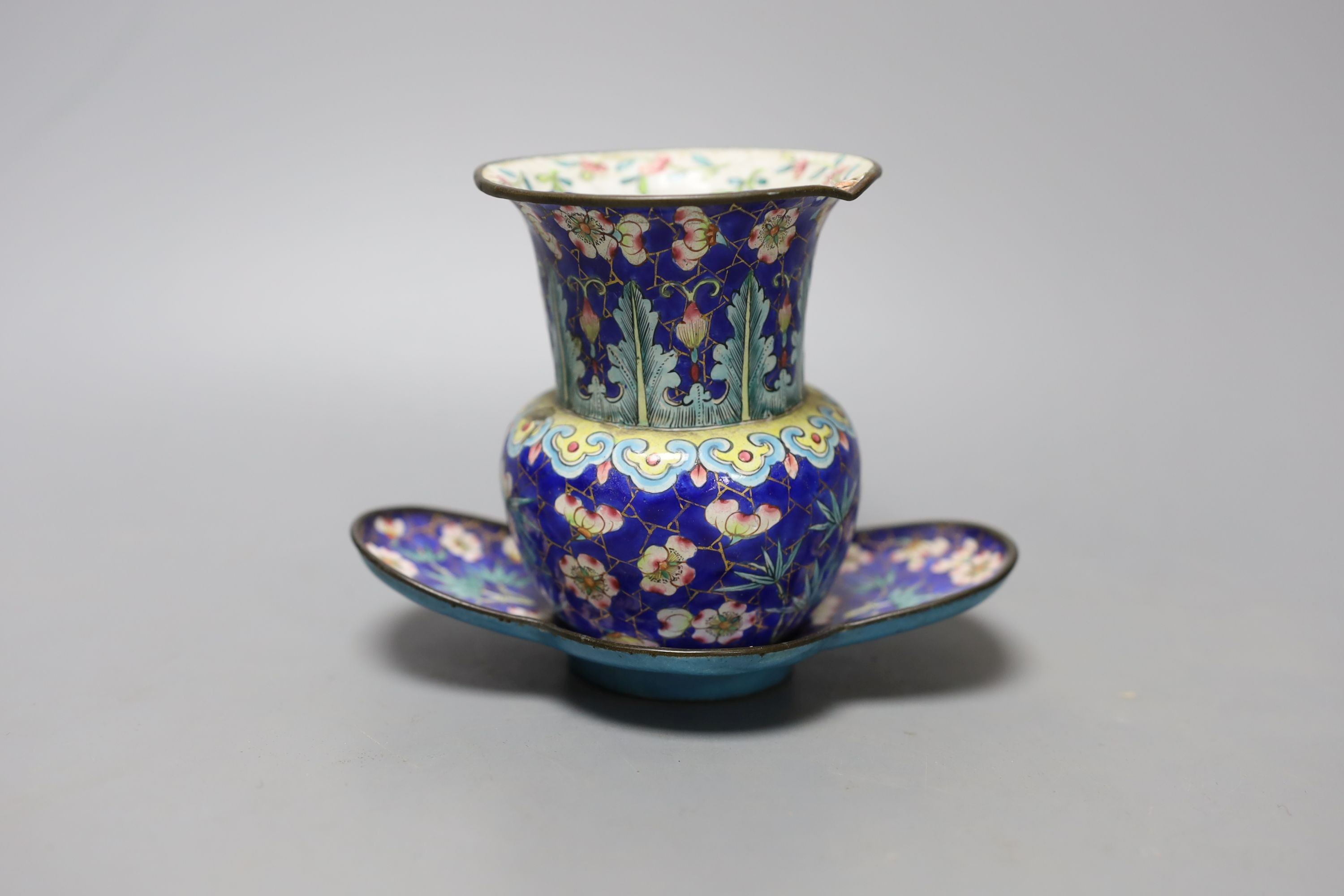 A group of 19th century Canton enamelled wares, including a vase and stand, two tea bowls and saucers and two dishes